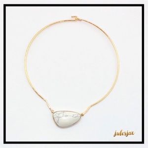 Marbled stone on gold wire necklace collar bone